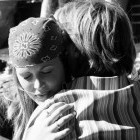 A woman hugging another person